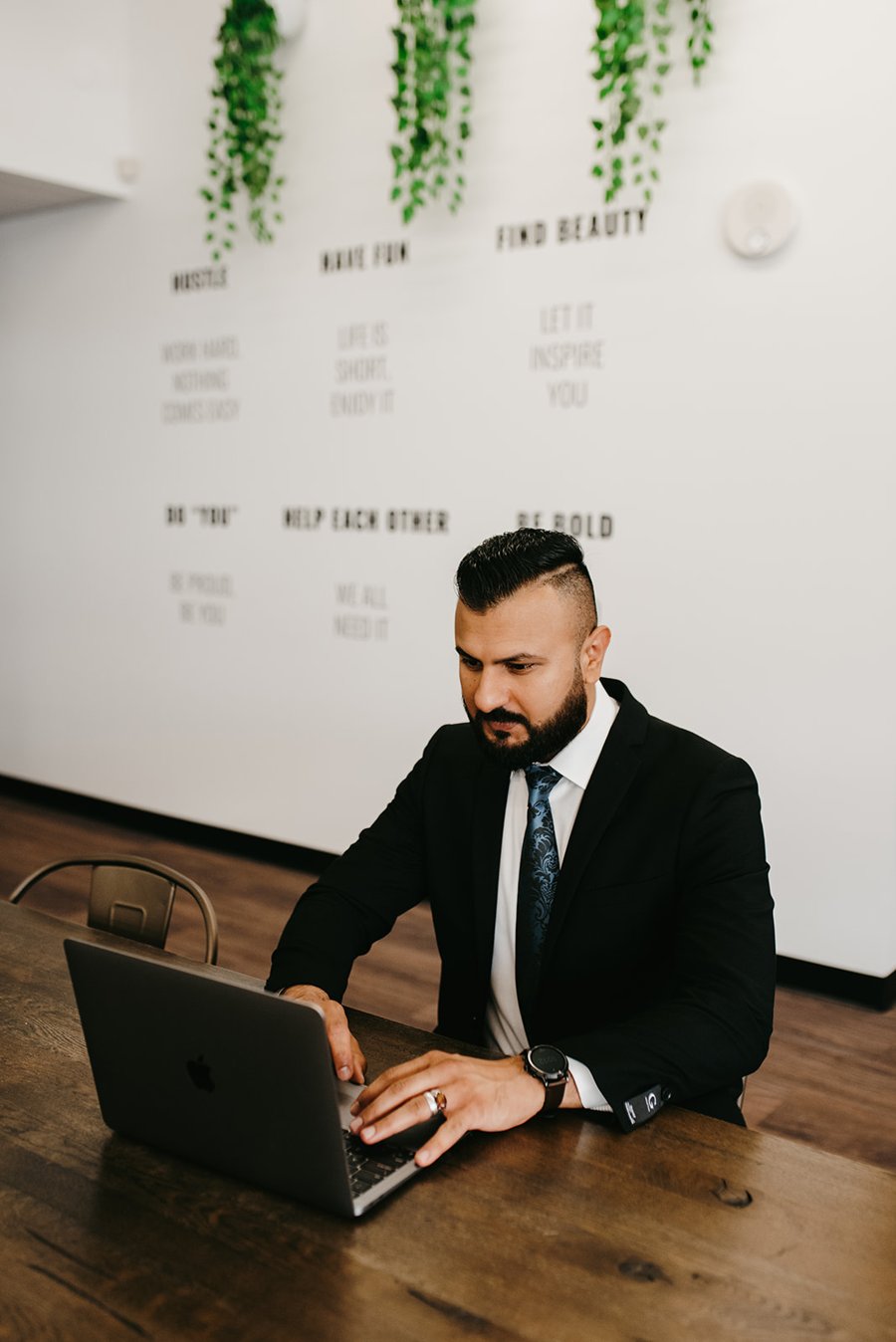 Uzair M Awan working at his desk